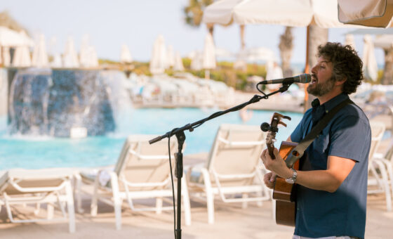 Man singing with guitar