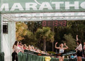 Marathon Runner Crossing Finish Line